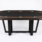 An oval poker table with a black felt playing surface, dark wood edges, and black metal legs, photographed on a clean white studio background.