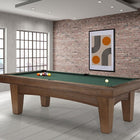 A Brunswick Billiards Winfield 8' Pool Table with balls in a modern brick-walled room.