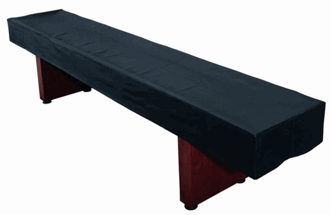 A Playcraft Home Series Deluxe Shuffleboard Kit with a black cover on the table.