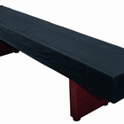 A Playcraft Home Series Deluxe Shuffleboard Kit with a black cover on the table.