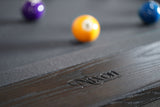 Nixon KAI 7' Slate Pool Table by Nixon Billiards in Waxed Brown, shown with billiard balls.