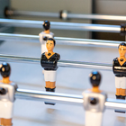 Close-up of René Pierre Color Menthe Indoor Foosball Table with players on telescopic rods.