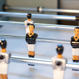 Close-up of René Pierre Color Menthe Indoor Foosball Table with players on telescopic rods.