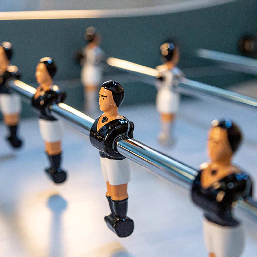 Close-up of René Pierre Color Menthe Foosball Table players on telescopic rods.