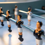 Close-up of René Pierre Color Menthe Foosball Table players on telescopic rods.