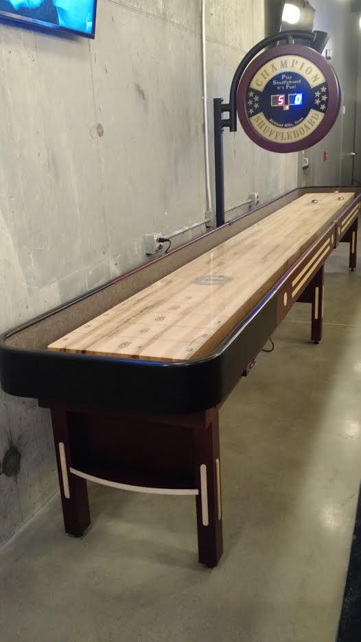 Champion 9' The Grand Champion Shuffleboard Table by Champion with electronic scoreboard & Lifetime Polymer finish.