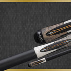 Close-up of three Lucasi Lux® LUX66 Pool Cues with inlays on a dark background.