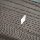 A clear plastic wedge sits on a Nixon Birdy 8' Slate Pool Table in Grayson Grey by Nixon Billiards.