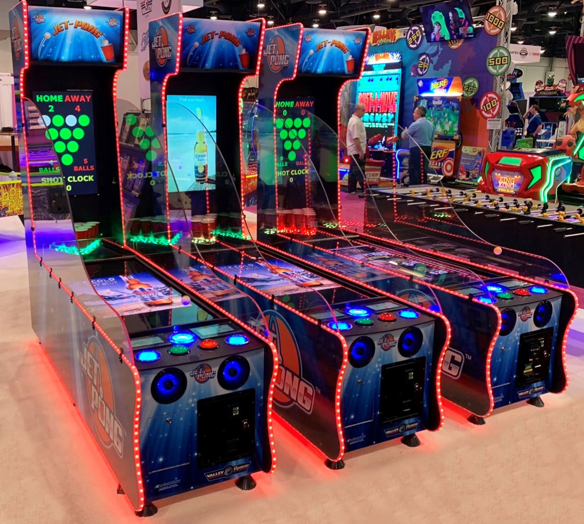 Three Valley Jet-Pong machines create a lively vibe with vibrant LED lights.