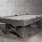 Nixon Georgia 8' Slate Pool Table in Grayson Grey by Nixon Billiards shown in industrial room.