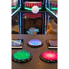 Valley Jet-Pong: An electronic tabletop game with colored buttons and smartphone integration.