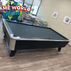 A Great American Legacy Home pool table in a room with chairs, tables, and wall art.