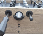 Close-up of Hathaway Braxton 55'' Foosball Table handles and score dial in Barnwood finish.