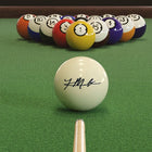 Imperial Khalil Mack Players Signature Cue Ball racked on green table, cue stick aimed.