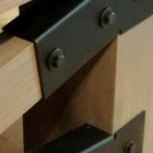 Close-up of metal brackets on the Champion Rustic 9' Shuffleboard Table by Champion.