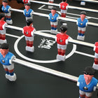 Close-up of a DMI Sports American Legend Charger 52" foosball table with red and blue figures.