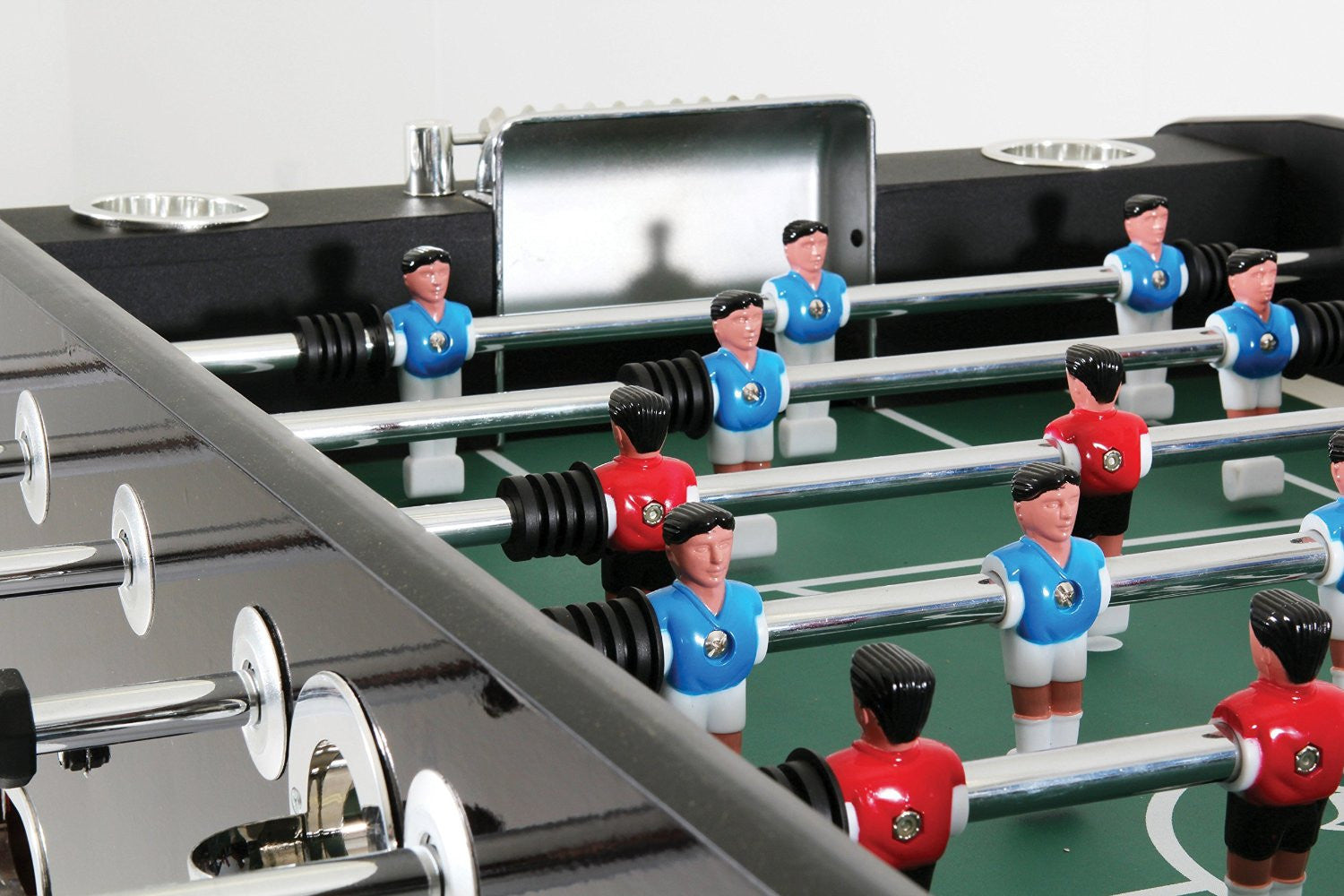 Players on a by DMI Sports Euro Star Foosball Table by Atomic available at Foosball Planet.