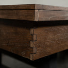 Close-up of Nixon Hunter 7' Slate Pool Table's dovetail joint in Brushed Walnut by Nixon Billiards.