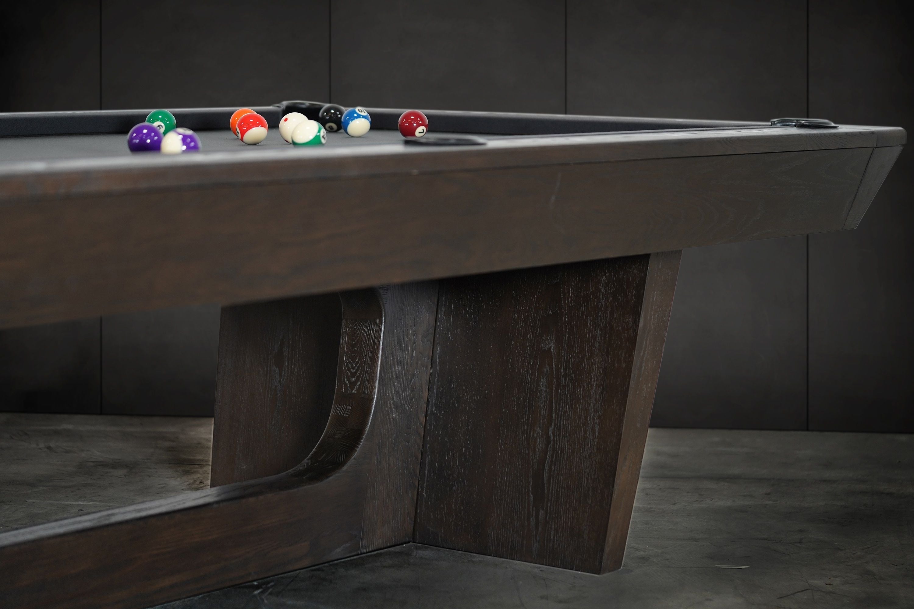 Nixon KAI 7' Slate Pool Table by Nixon Billiards in waxed brown, billiard balls on felt.