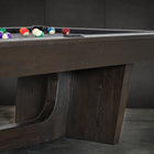 Nixon KAI 7' Slate Pool Table by Nixon Billiards in waxed brown, billiard balls on felt.