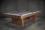 The Nixon KAI 7' Slate Pool Table by Nixon Billiards features a walnut finish and dark felt.