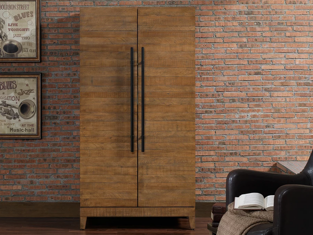 American Heritage Billiards Braxton wine and spirit cabinet with stemware holders, by brick wall.