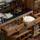 American Heritage Billiards Braxton Cabinet with open drawers, stemware holders, and bottle shelves.