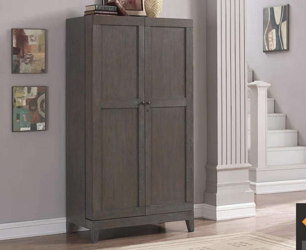 American Heritage Billiards Fairfield Wine Cabinet in Glacier on Oak stands near artwork and stairs.