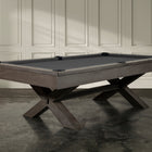 The Nixon CrissyCross 7' Slate Pool Table by Nixon Billiards features crossed wooden legs.