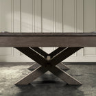 The Nixon Billiards CrissyCross 7' Slate Pool Table in charcoal stands by a paneled wall.