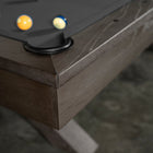 Corner of the Nixon CrissyCross 7' Slate Pool Table in Charcoal by Nixon Billiards with balls.