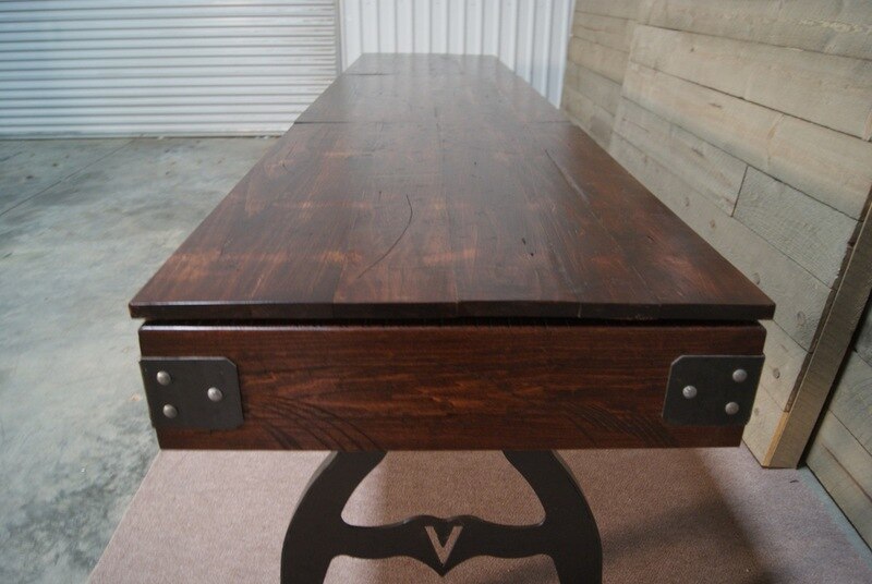 Venture Williamsburg 12' Shuffleboard Table by Venture in an industrial-style room.