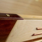 Close-up of a drawer on the Venture Grand Deluxe 18' Shuffleboard Table, hardware visible.