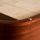 Close-up of Venture Grand Deluxe 18' Shuffleboard Table corner with brass screw and light wood.