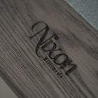 Nixon Billiards logo engraved on Birdy 8' Slate Pool Table in Grayson Grey finish.