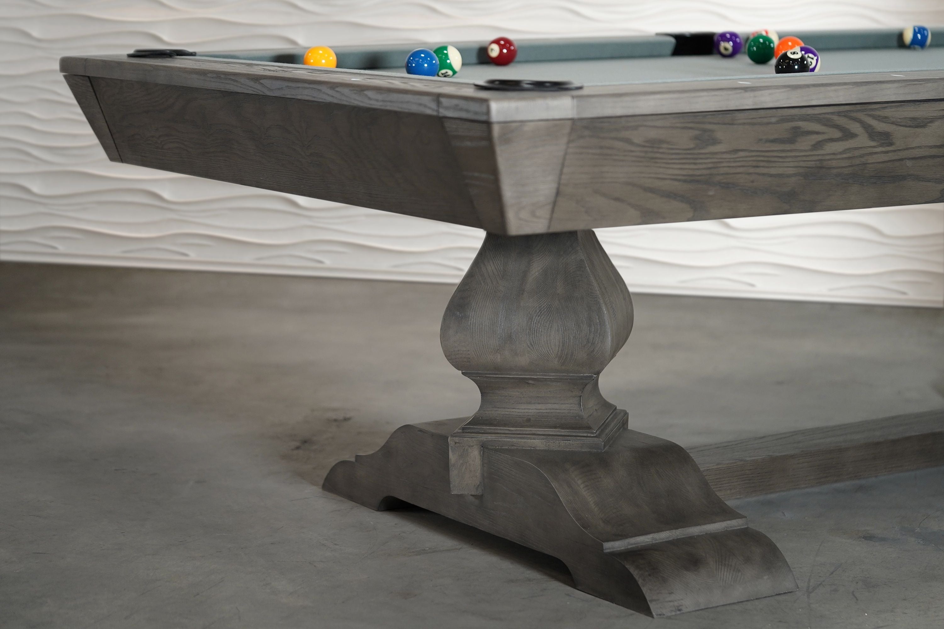 Close-up of Nixon Birdy 8' Slate Pool Table in Grayson Grey by Nixon Billiards with balls arranged.