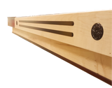 Close-up of Champion 9' The Grand Champion Shuffleboard Table beam with two grooves and medallion.