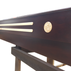 Close-up of the Champion Grand Champion 9' Shuffleboard Table with gold accents and Lifetime Polymer.