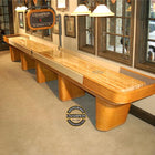Champion Capri 18' Shuffleboard Table by Champion stands in a carpeted game room.
