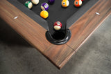 Corner of Nixon KAI 8' Slate Pool Table in Walnut by Nixon Billiards, balls racked for play.