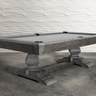 Nixon Birdy 7' Slate Pool Table in Grayson Grey by Nixon Billiards on concrete, wavy white wall.