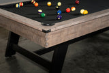 Close-up of Nixon Hunter 7' Slate Pool Table by Nixon Billiards, balls on black felt surface.