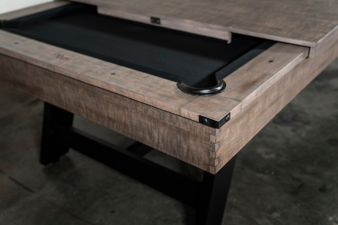 Close-up of a Nixon Hunter 7' Slate Pool Table in Antique Finish with black surface and cover.