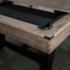 Close-up of a Nixon Hunter 7' Slate Pool Table in Antique Finish with black surface and cover.