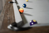 Close-up of billiard balls on a Nixon Billiards Hunter 7' Slate Pool Table in Antique Finish.