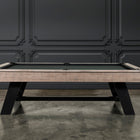 Nixon Hunter 7' Slate Pool Table in Antique Finish by Nixon Billiards against a dark wall.