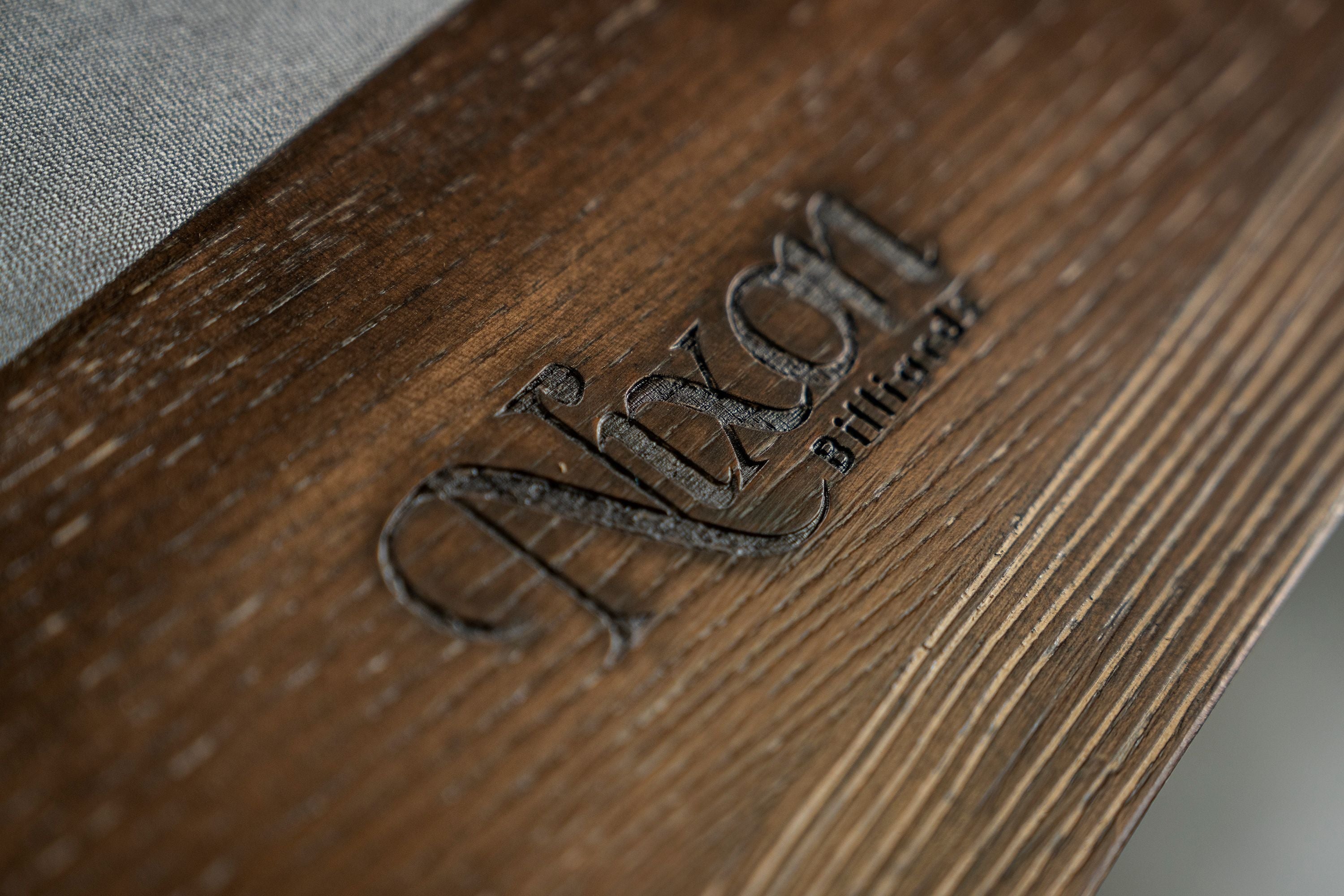 Close-up of Nixon Hunter 7' Slate Pool Table by Nixon Billiards in brushed walnut finish.