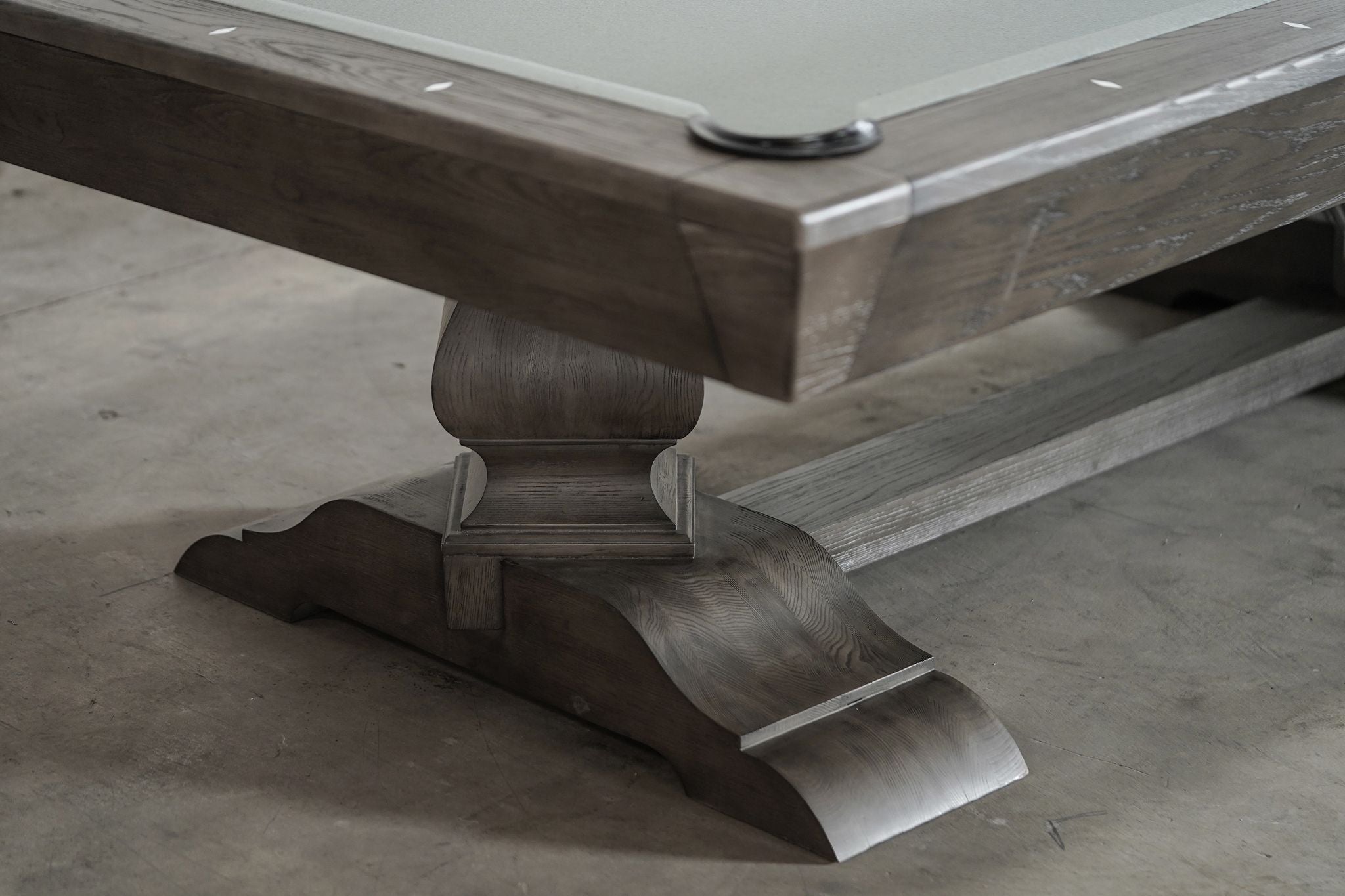 Close-up of a Nixon Birdy 8' Slate Pool Table leg and pocket in Grayson Grey finish.