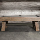 The Nixon Georgia 8' Slate Pool Table by Nixon Billiards sits on a concrete floor by a metal wall.