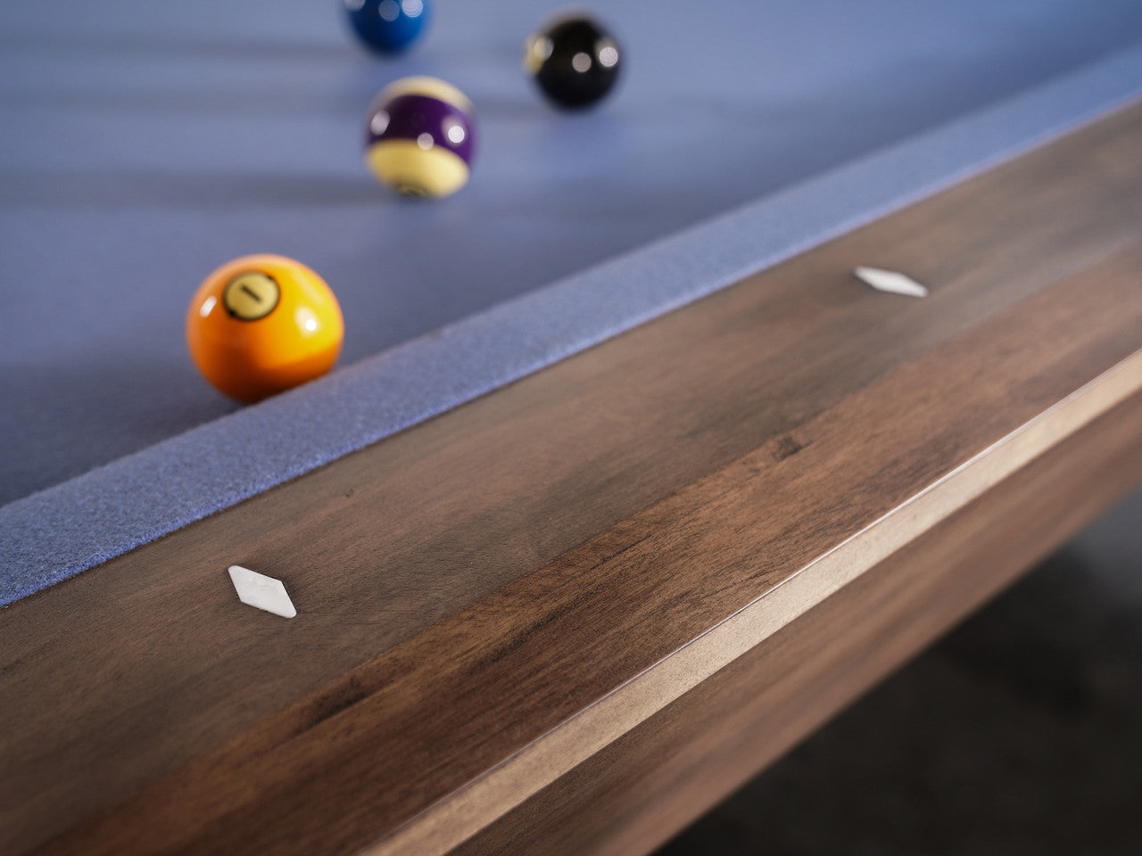 Close-up of Nixon Desyn 8' Slate Pool Table in Walnut by Nixon Billiards with dining top option.